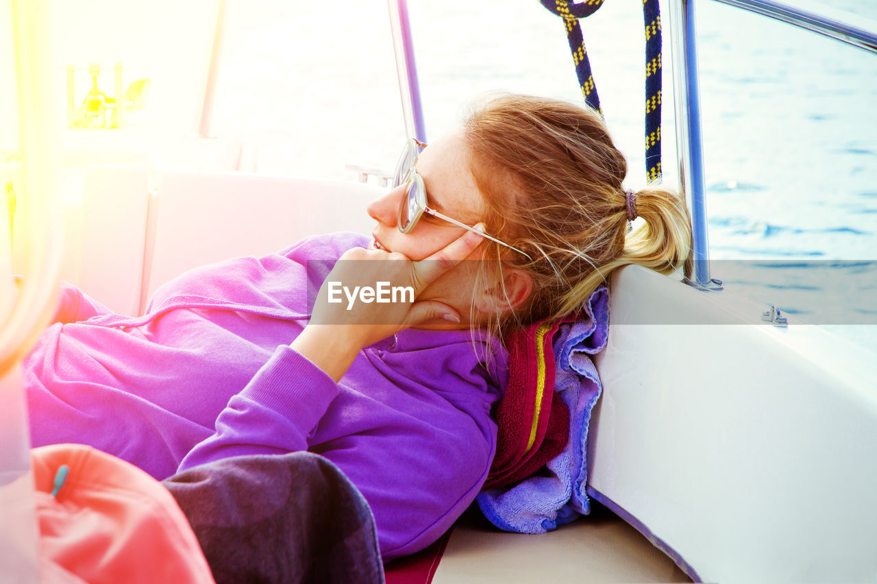 Young woman relaxing in boat