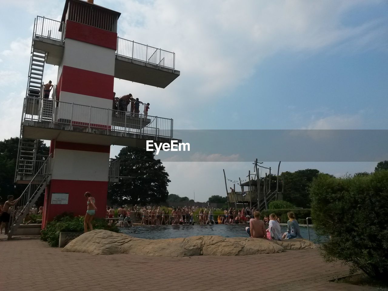 PEOPLE IN FRONT OF BUILT STRUCTURE