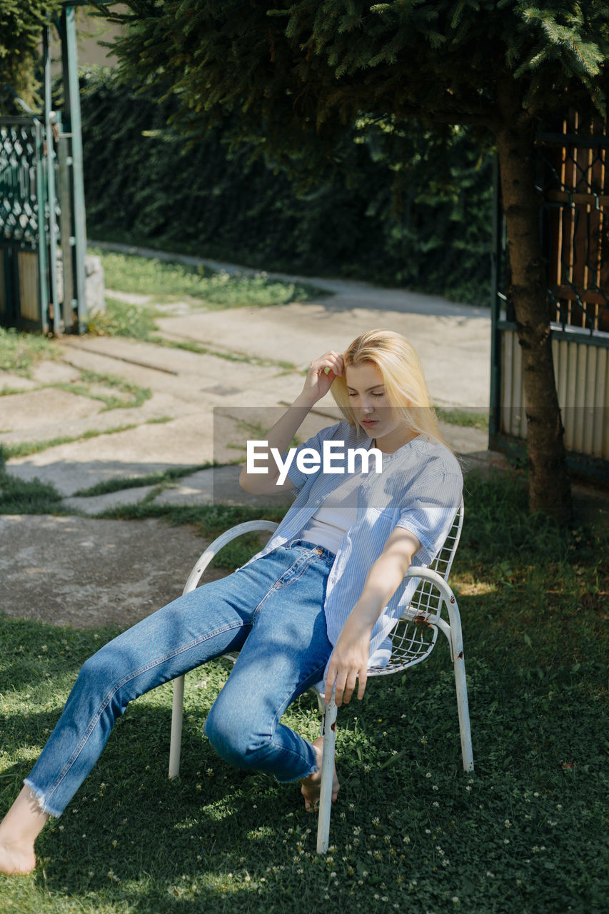 High angel view of woman sitting on chair