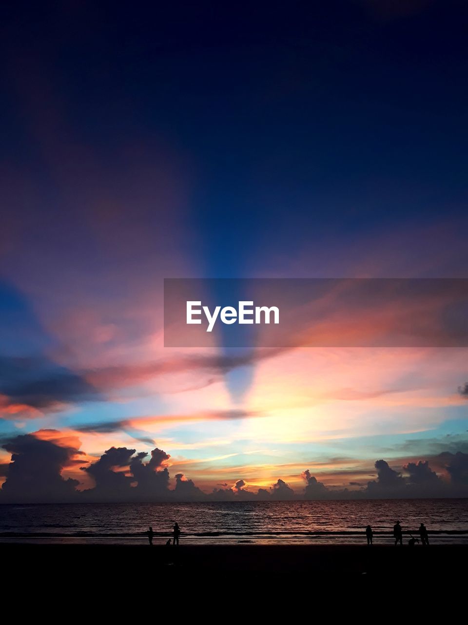 Scenic view of beach against sky during sunset