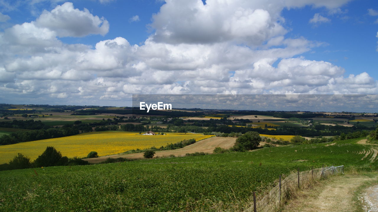 High angle view of agricultural field against cloudy sky