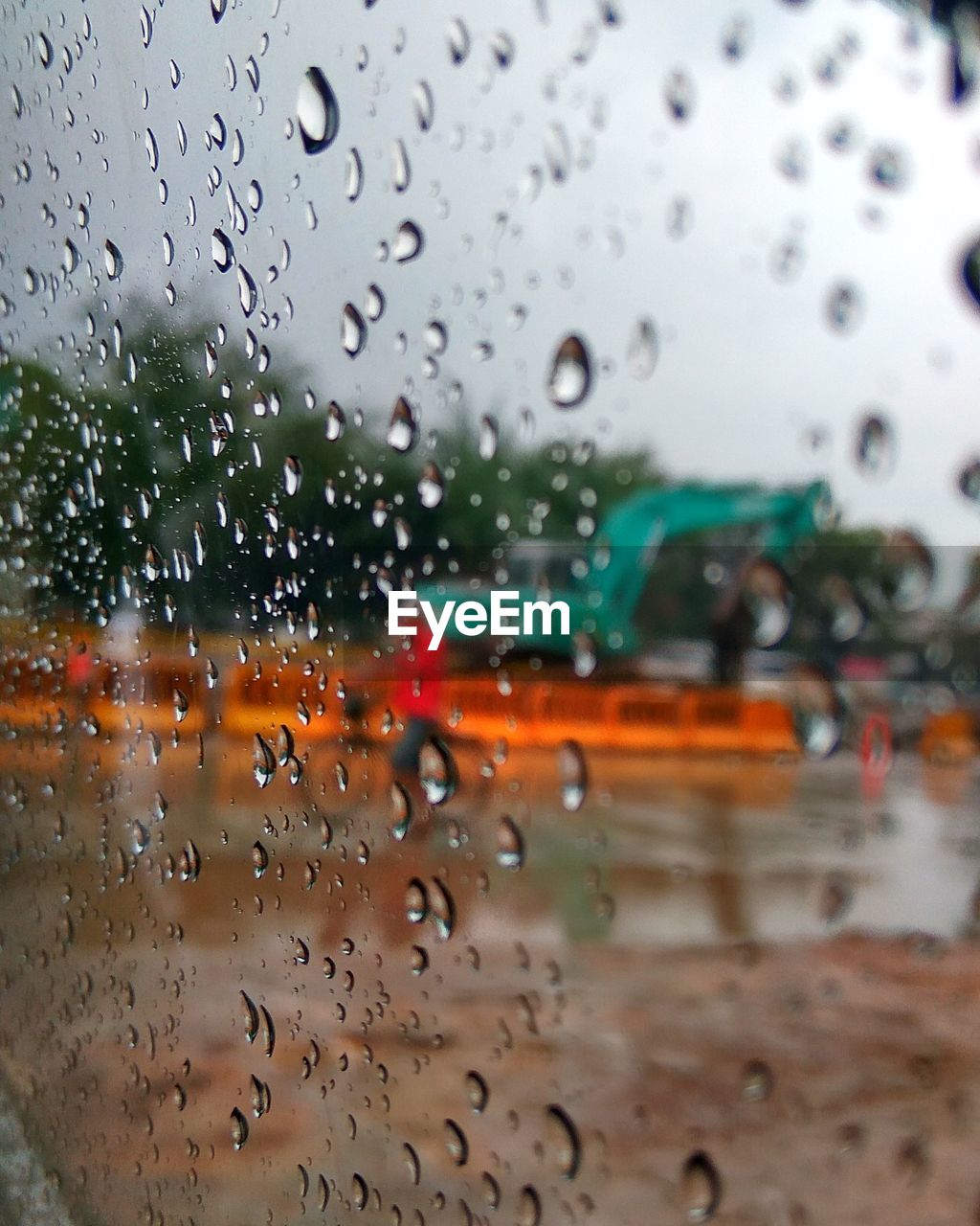 CLOSE-UP OF WATERDROPS ON GLASS AGAINST WINDOW