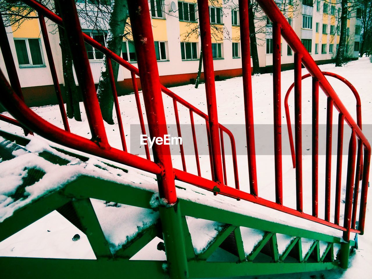 CLOSE-UP OF RED METAL PLAYGROUND