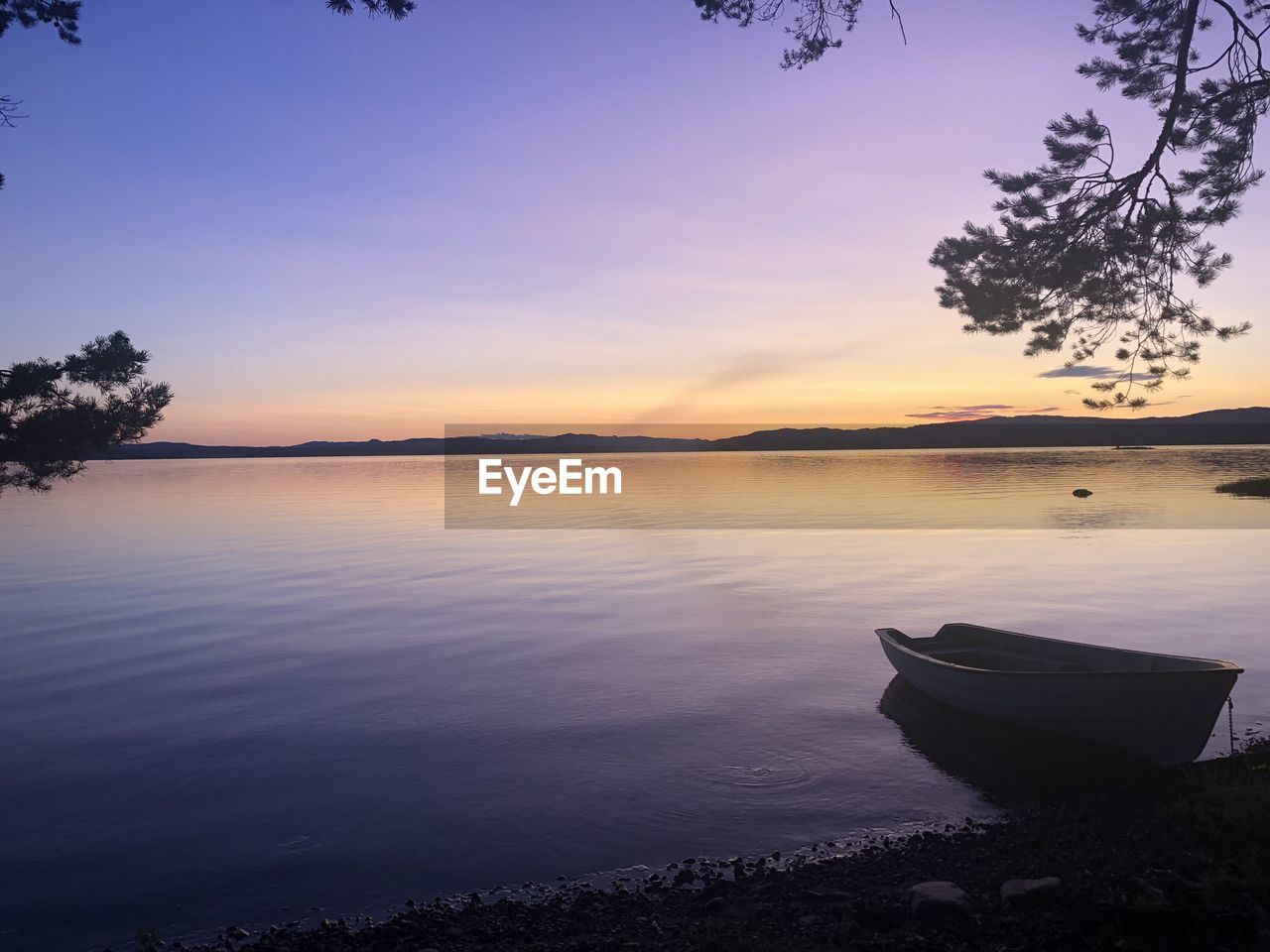 SCENIC VIEW OF LAKE DURING SUNSET