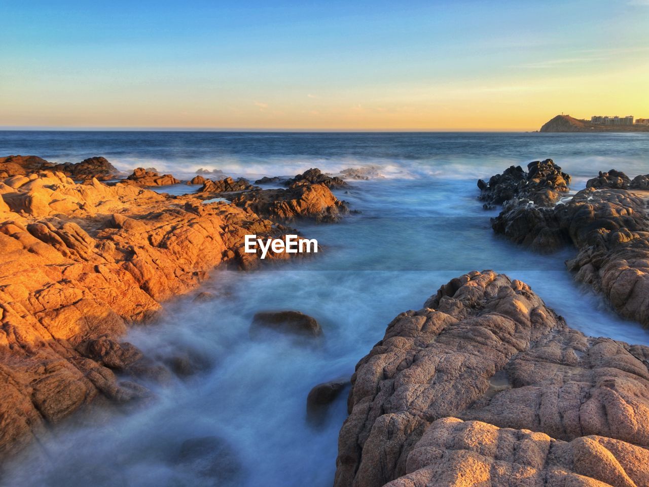 Scenic view of sea against sky during sunset