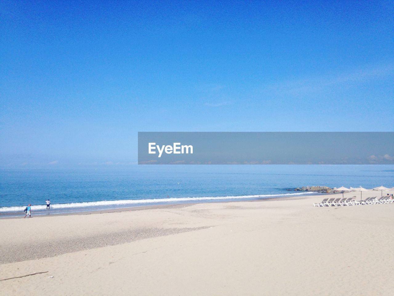 SCENIC VIEW OF BEACH AGAINST CLEAR SKY