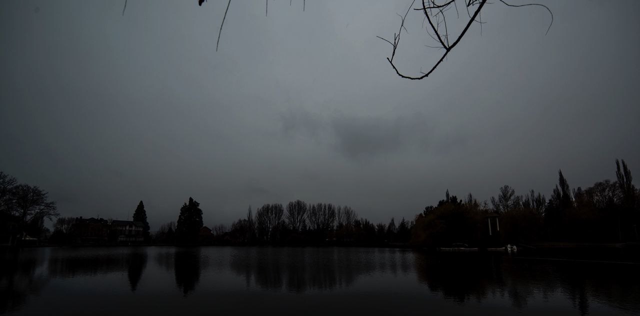 SCENIC VIEW OF LAKE AT SUNSET