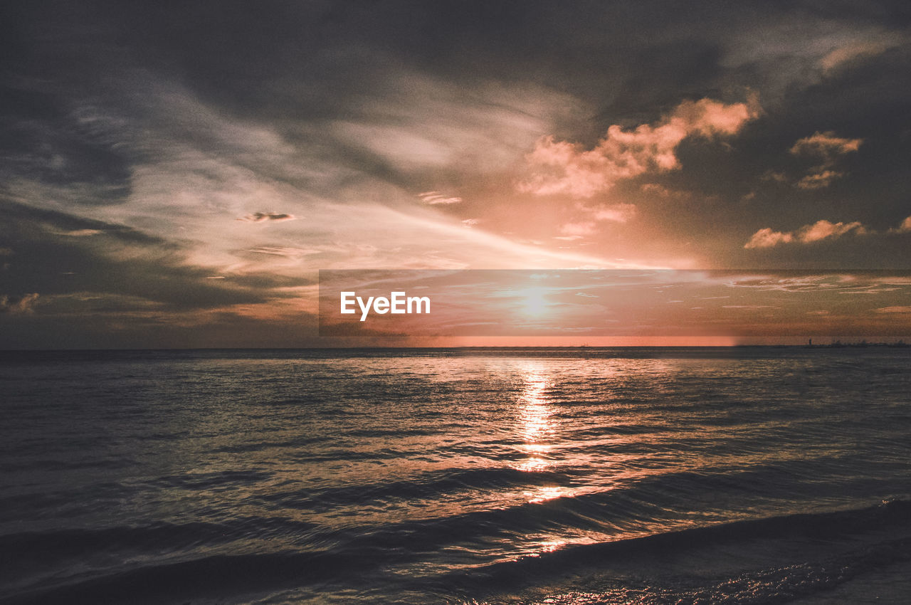 Scenic view of sea against sky during sunset