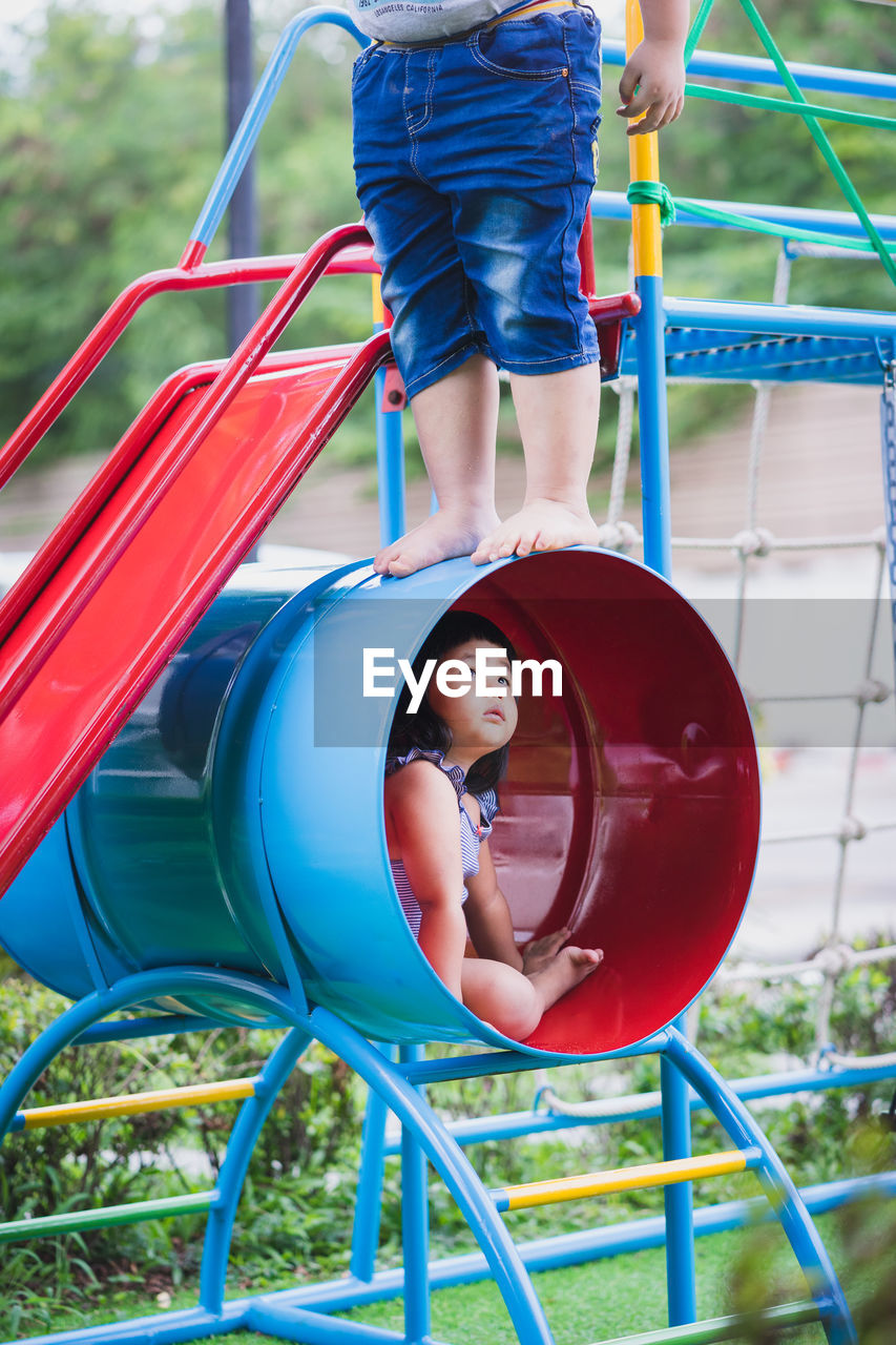 Kids playing on play equipment at park
