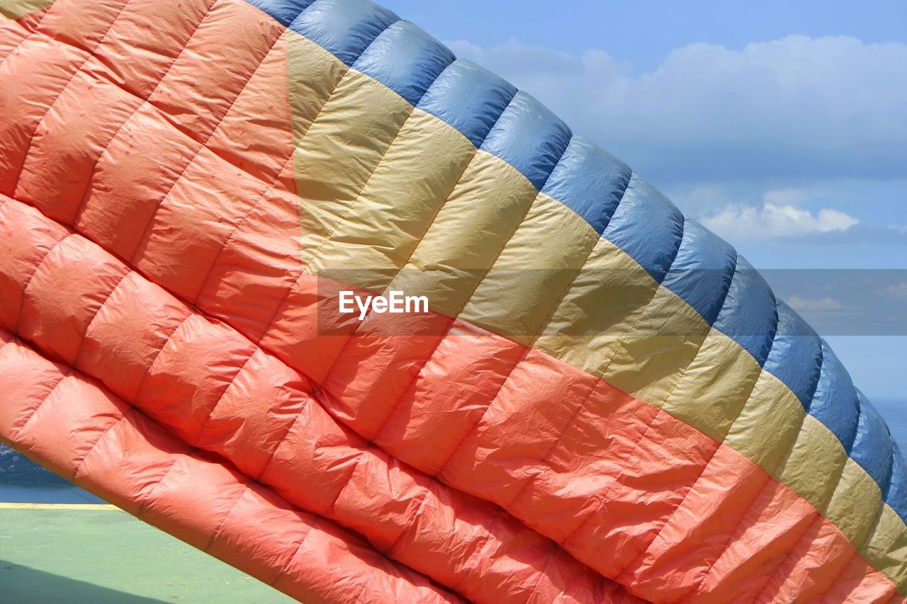 Parachute against sky on sunny day