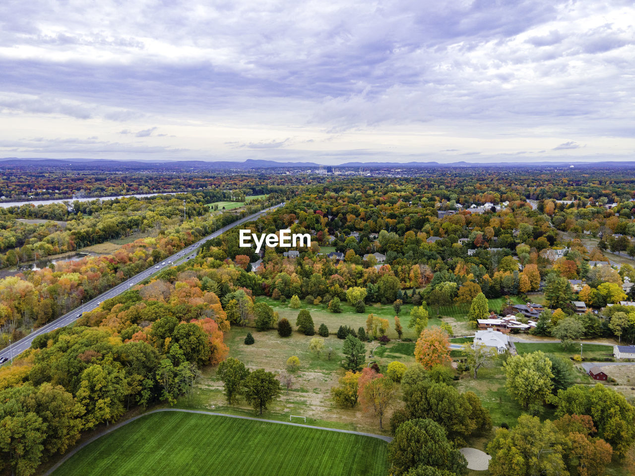 Springfield massachusetts in the distance across a sea of autumn colors in longmeadow.