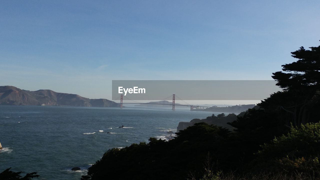 View of suspension bridge over sea