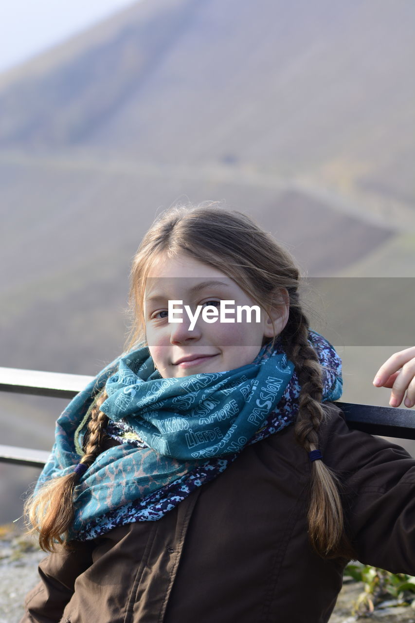 PORTRAIT OF YOUNG WOMAN WITH EYES CLOSED