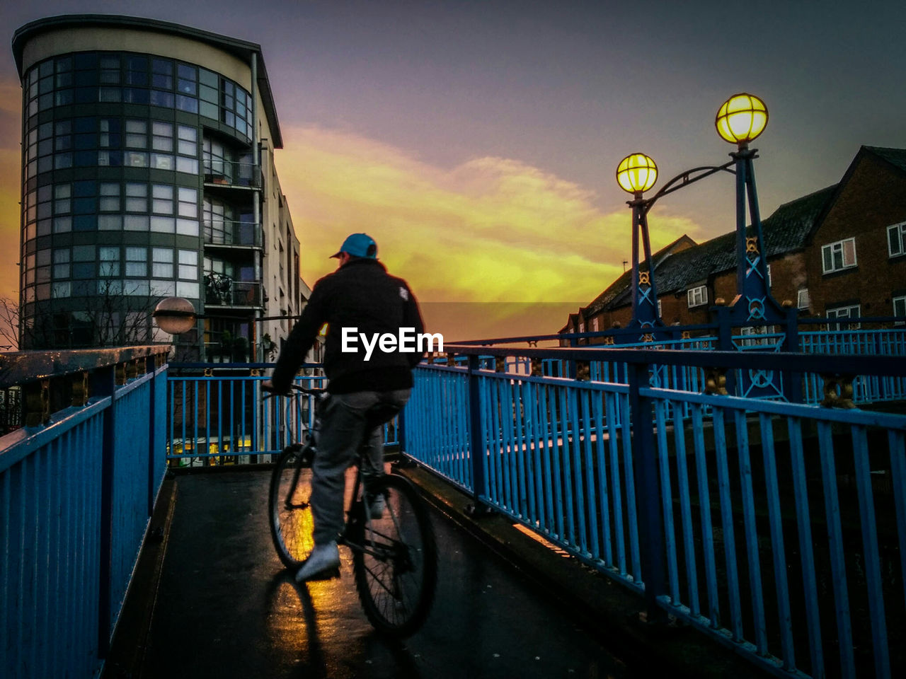 WOMAN IN CITY AT SUNSET