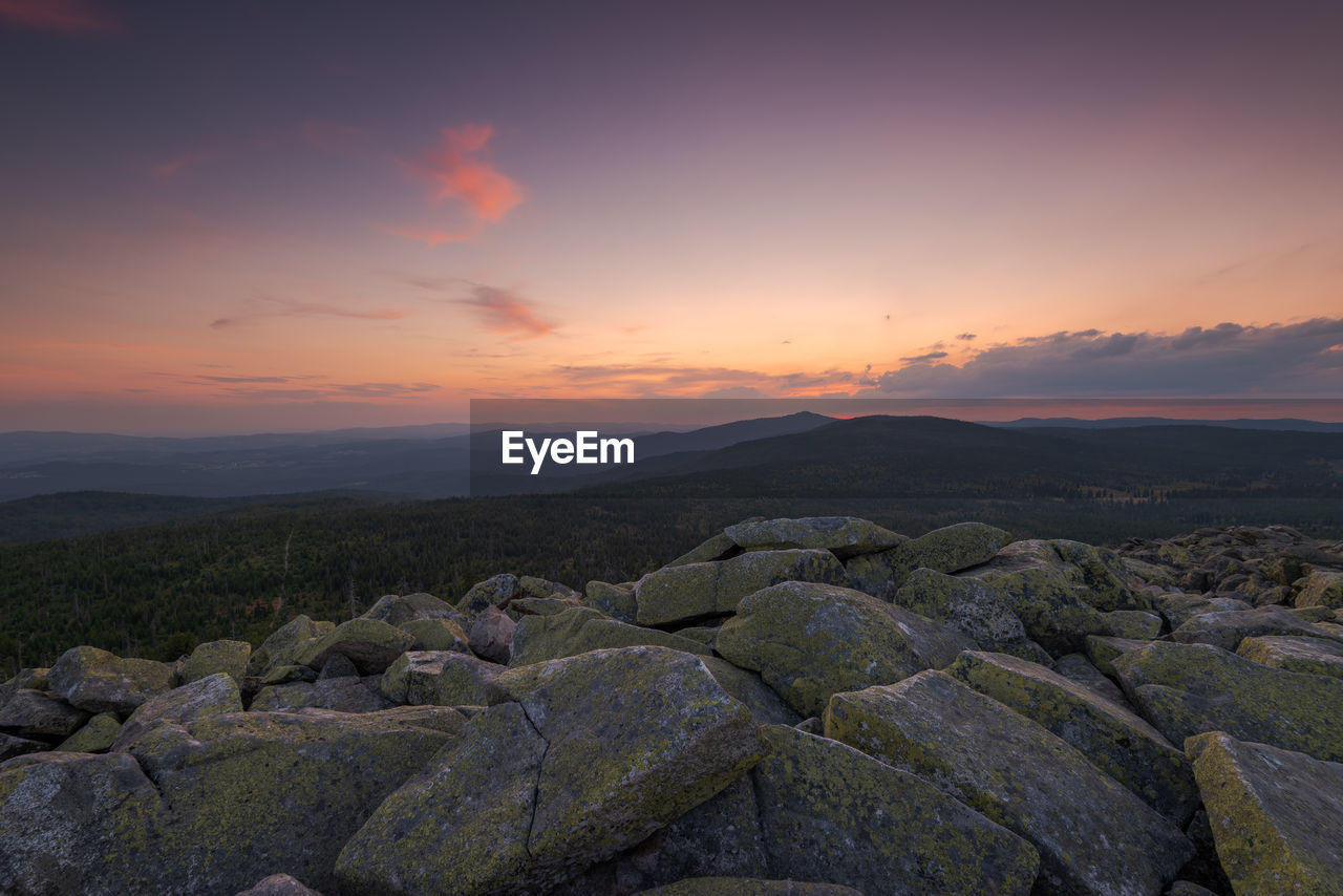 SCENIC VIEW OF ROCKS DURING SUNSET