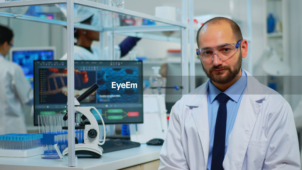 portrait of male scientist working at laboratory