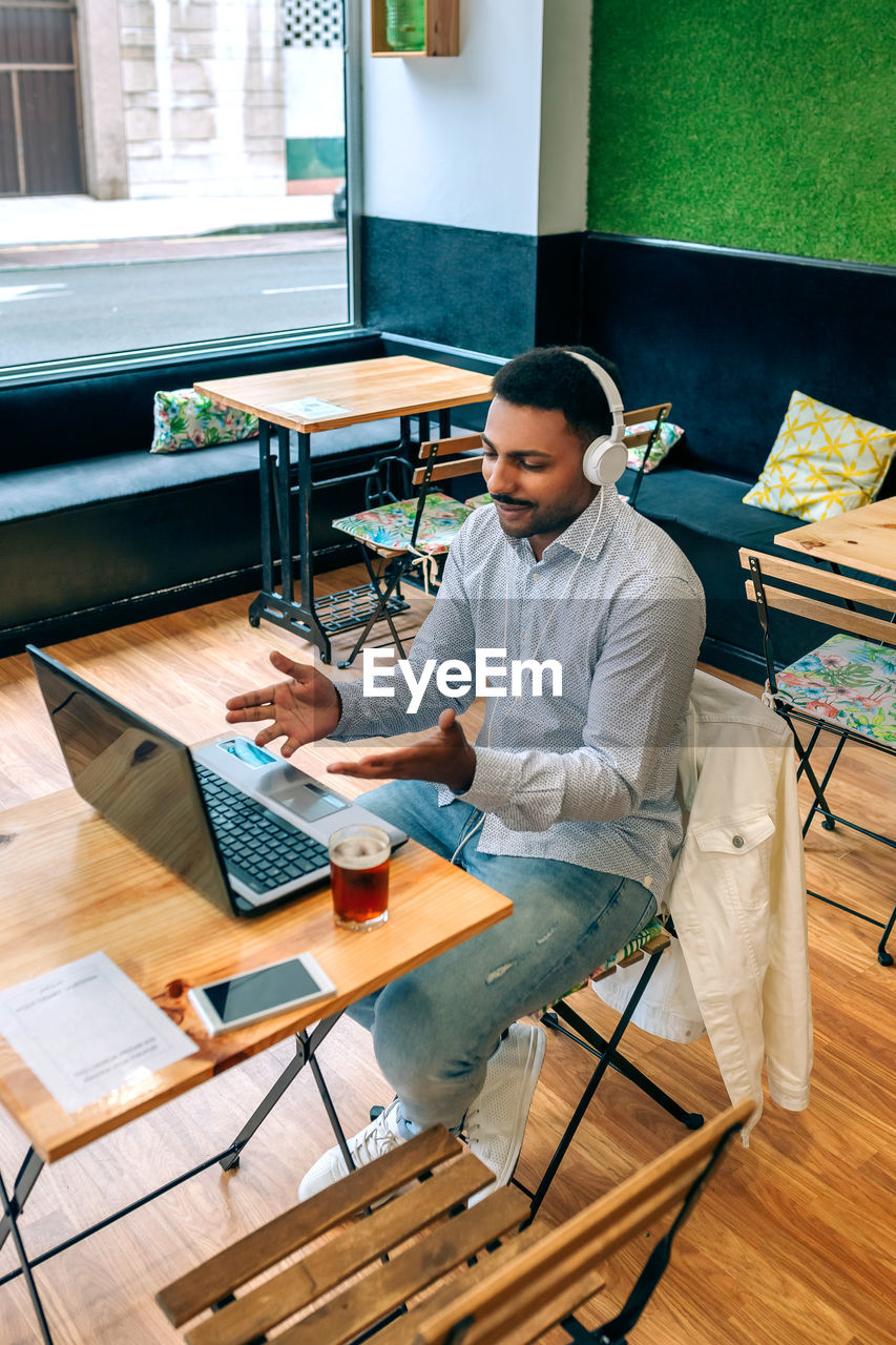 High angle view of man using laptop at home