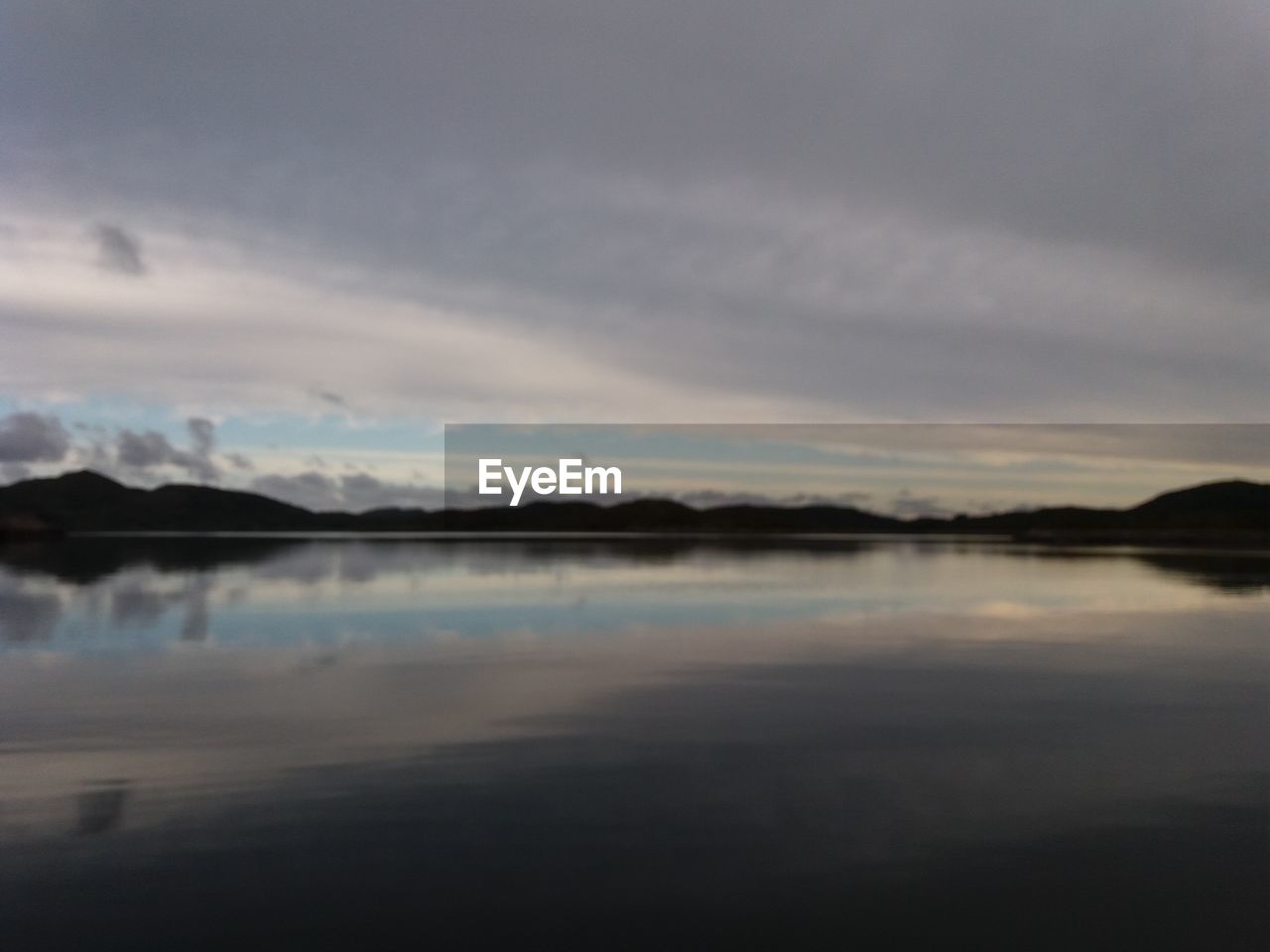 VIEW OF LAKE AGAINST SKY DURING SUNSET