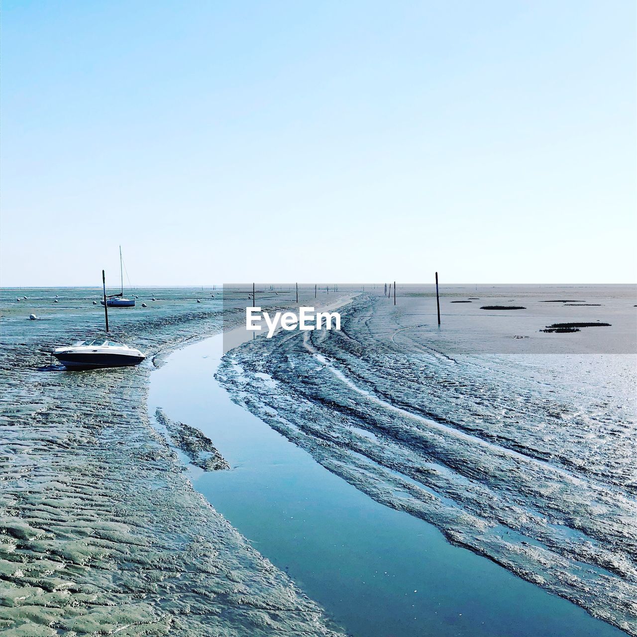 Scenic view of sea against clear sky during winter