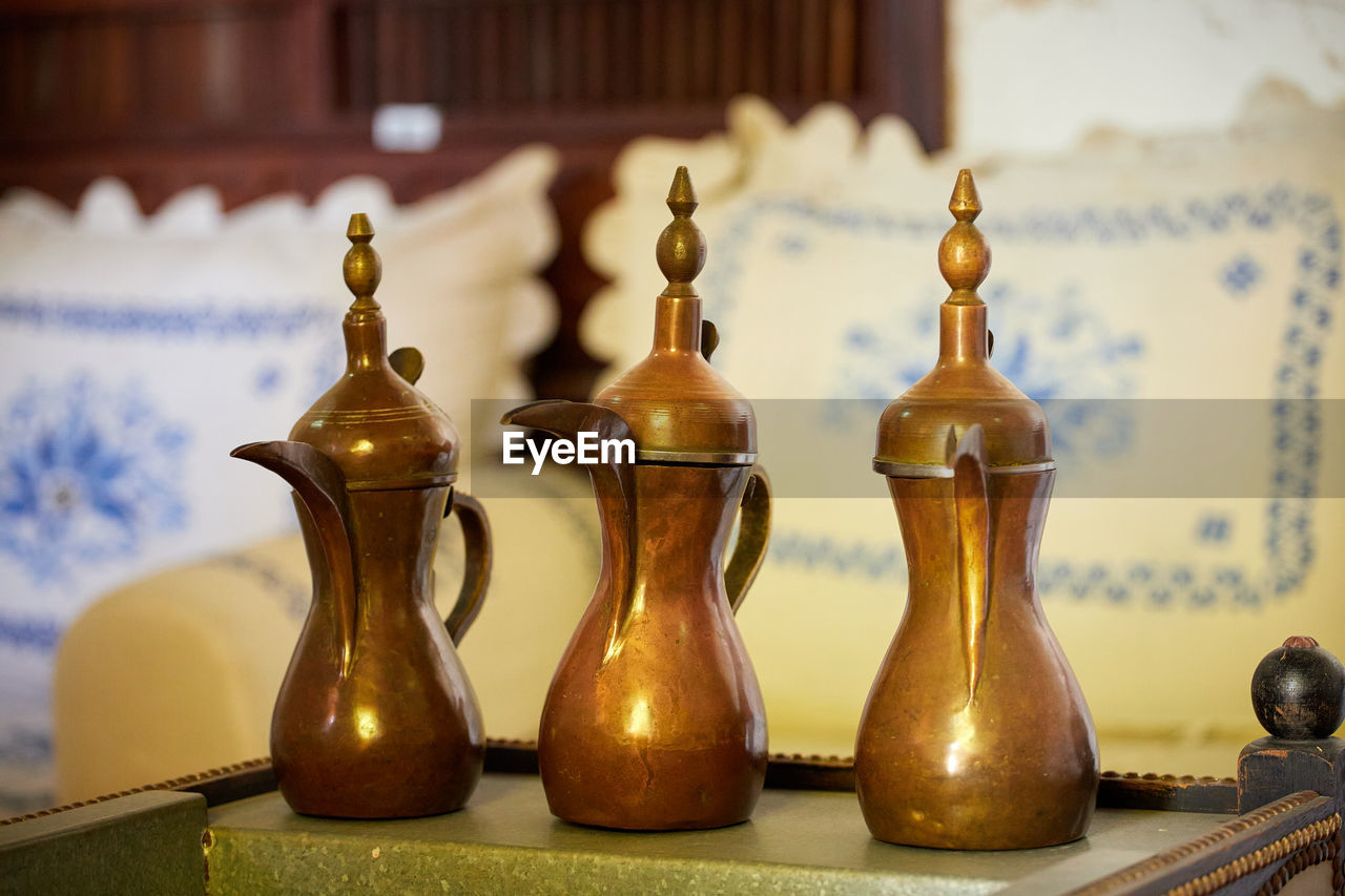 CLOSE-UP OF CANDLES ON TABLE