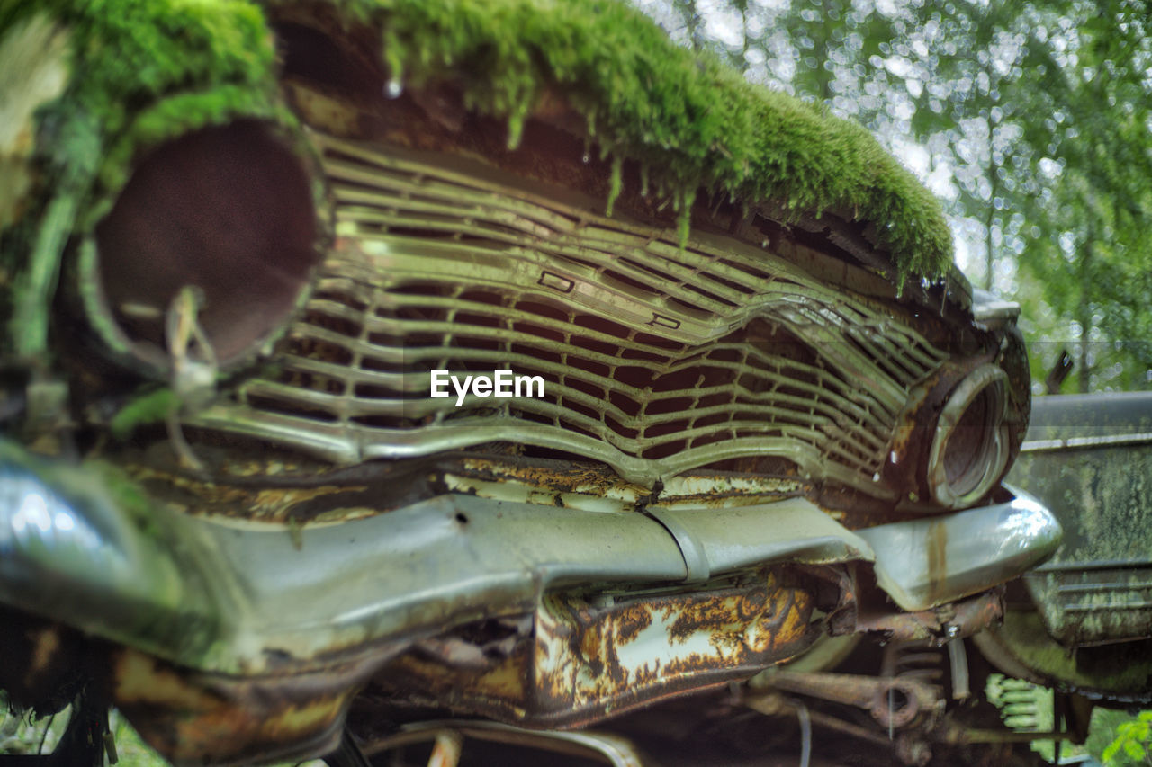 Close-up of rusty damaged car