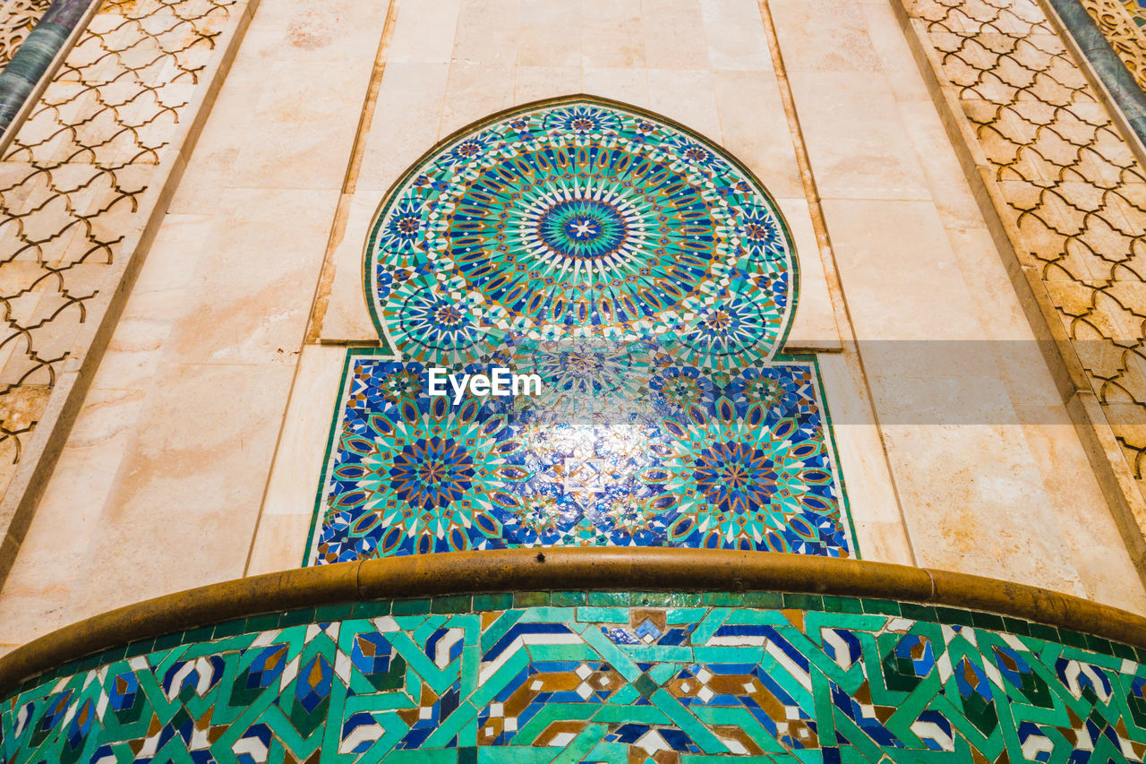 Low angle view of pattern on wall at mosque