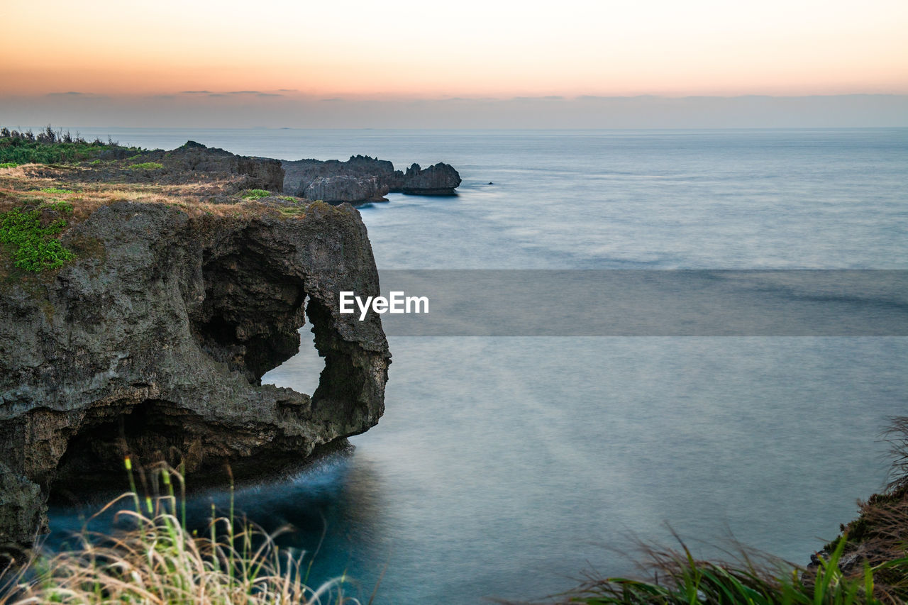 Scenic view of sea against sky during sunset