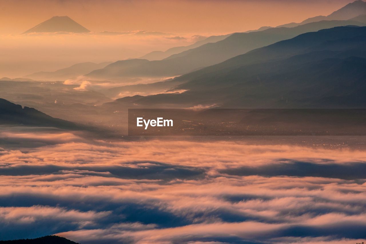 Scenic view of mountains against sky at sunset