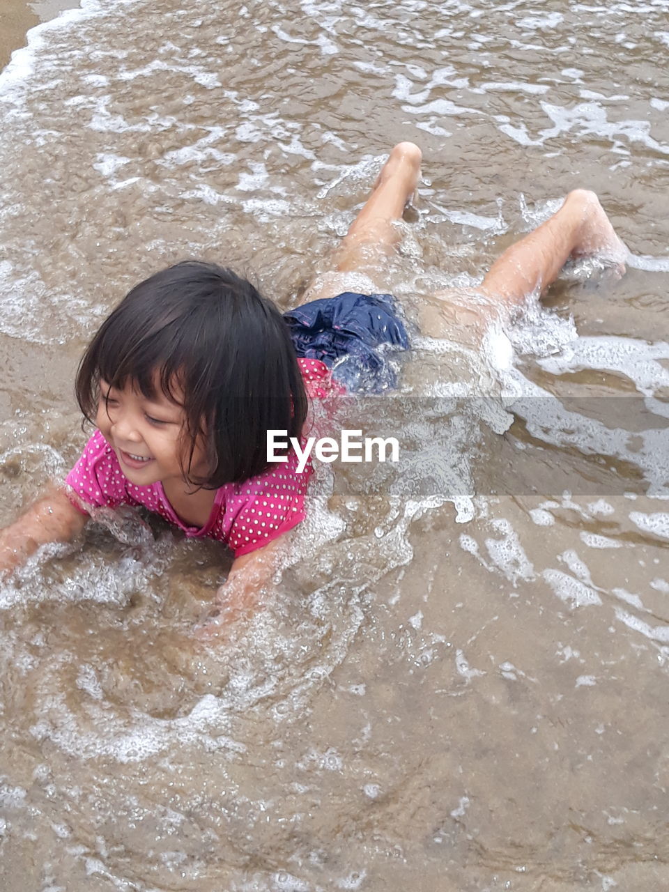 High angle view of woman in water at beach