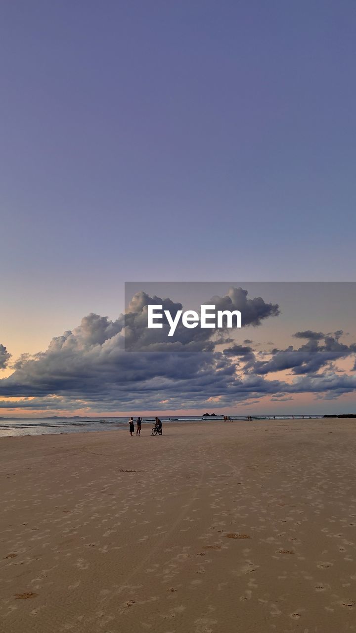 Scenic view of beach against sky during sunset