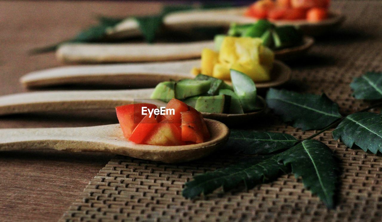 Close-up of chopped fruits in plate on table