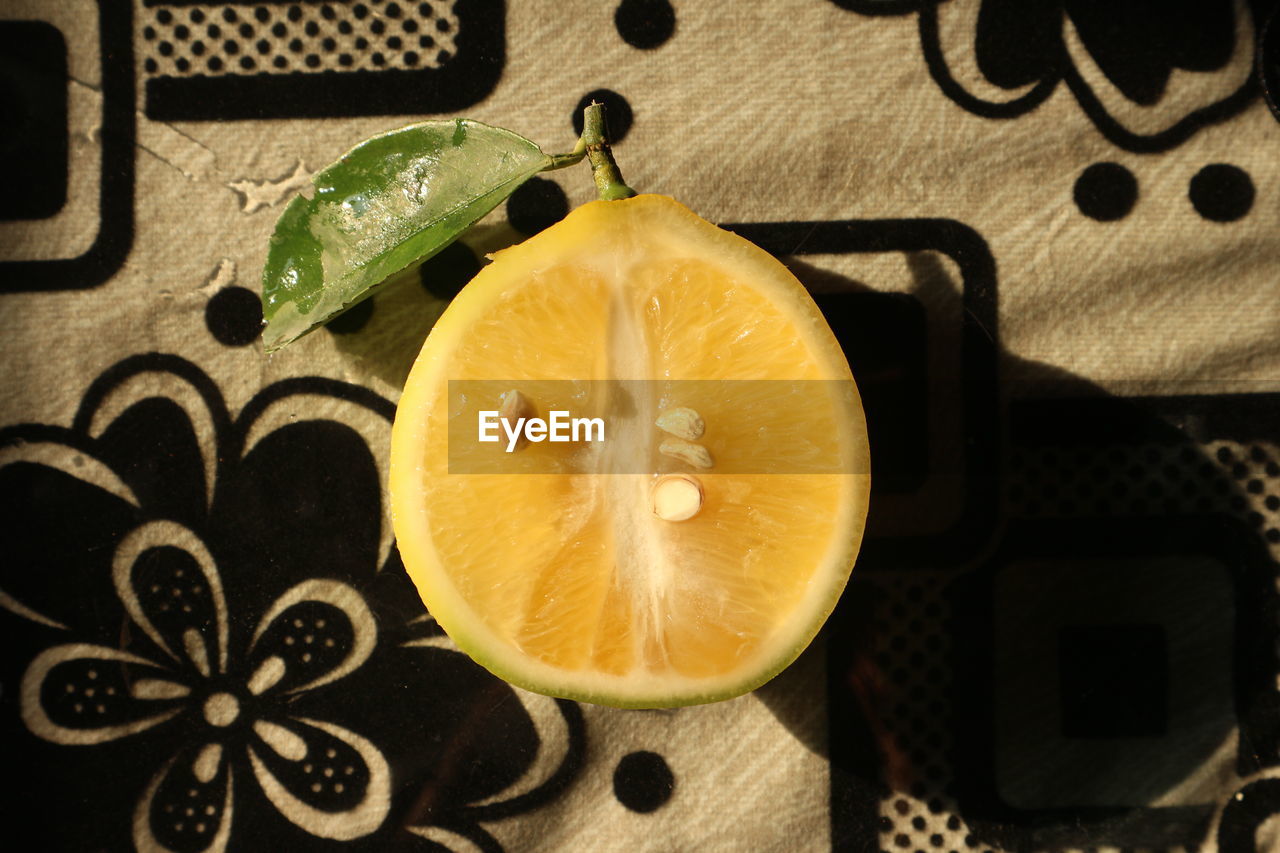 fruit, healthy eating, citrus fruit, food and drink, food, yellow, lemon, citrus, wellbeing, slice, produce, freshness, citron, indoors, orange, no people, directly above, plant, lime, still life photography, still life, high angle view, cross section, flower, grapefruit, table, close-up, green