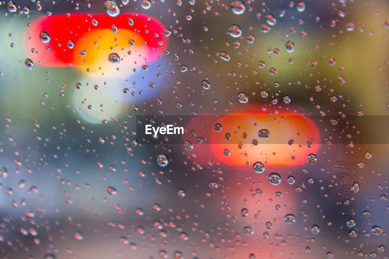 RAINDROPS ON GLASS WINDOW