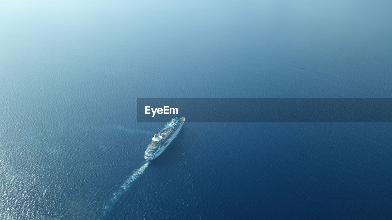 Aerial view of cruise ship sailing on sea