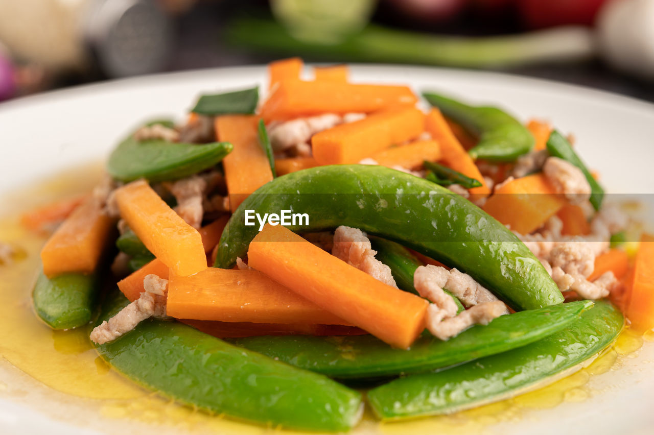 CLOSE-UP OF SALAD SERVED ON TABLE