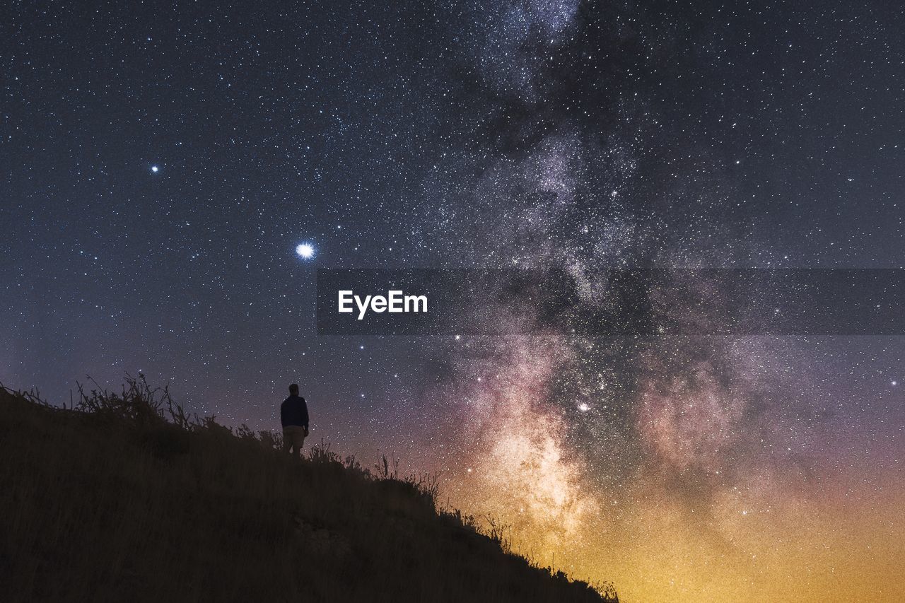 Scenic view of star field against sky at night