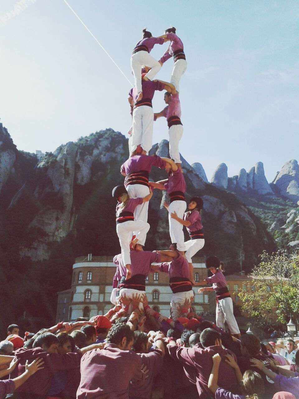 Team climbing to form human pyramid in traditional festival
