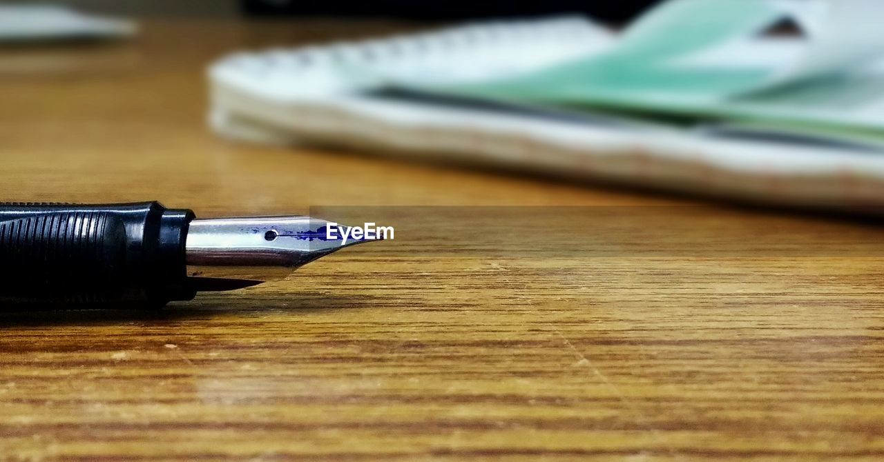 Close-up of fountain pen on table