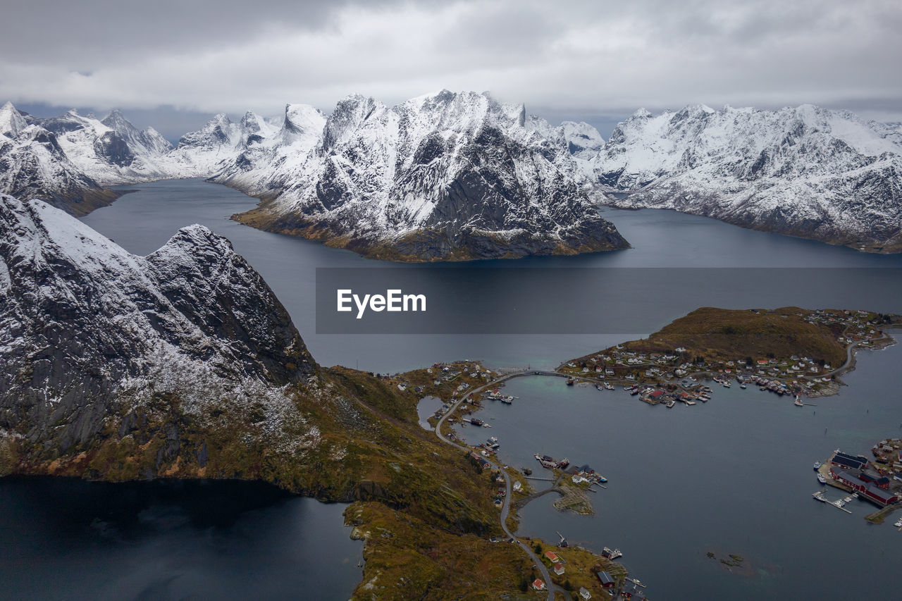 scenic view of lake and snowcapped mountains against sky