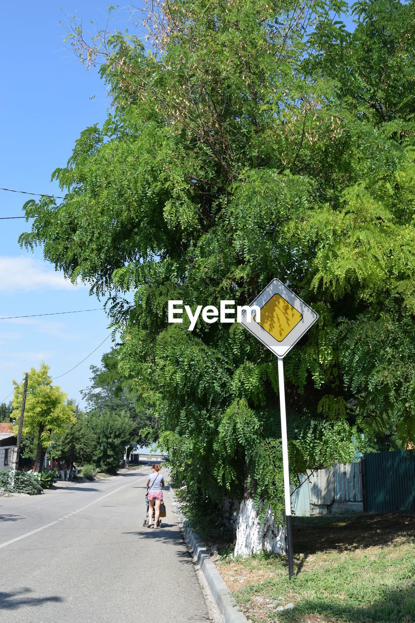 PEOPLE WALKING ON ROAD