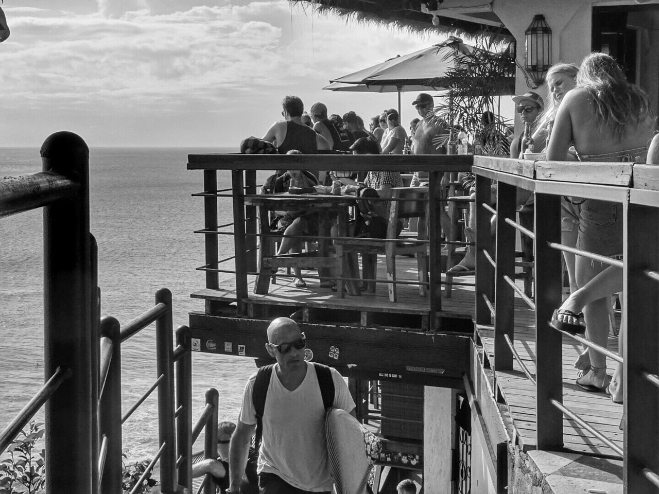 VIEW OF PEOPLE ON RAILING