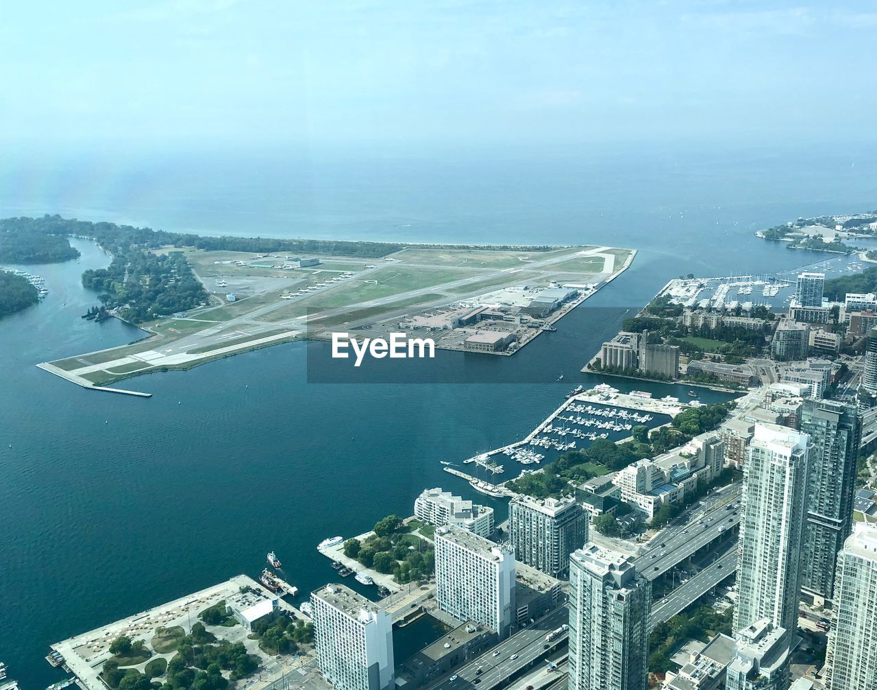 HIGH ANGLE VIEW OF BUILDINGS AND SEA