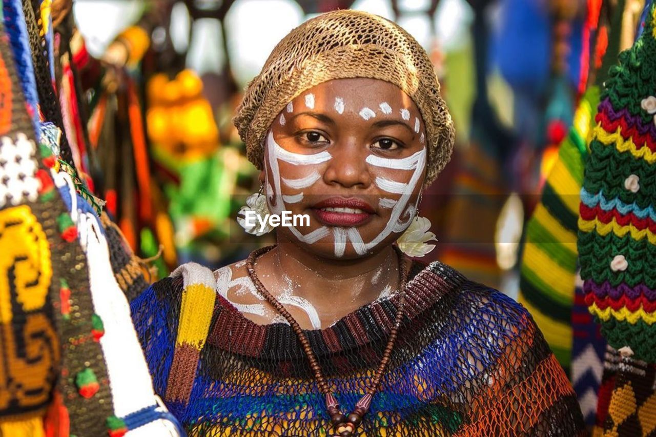 Portrait of woman with multi colored decoration