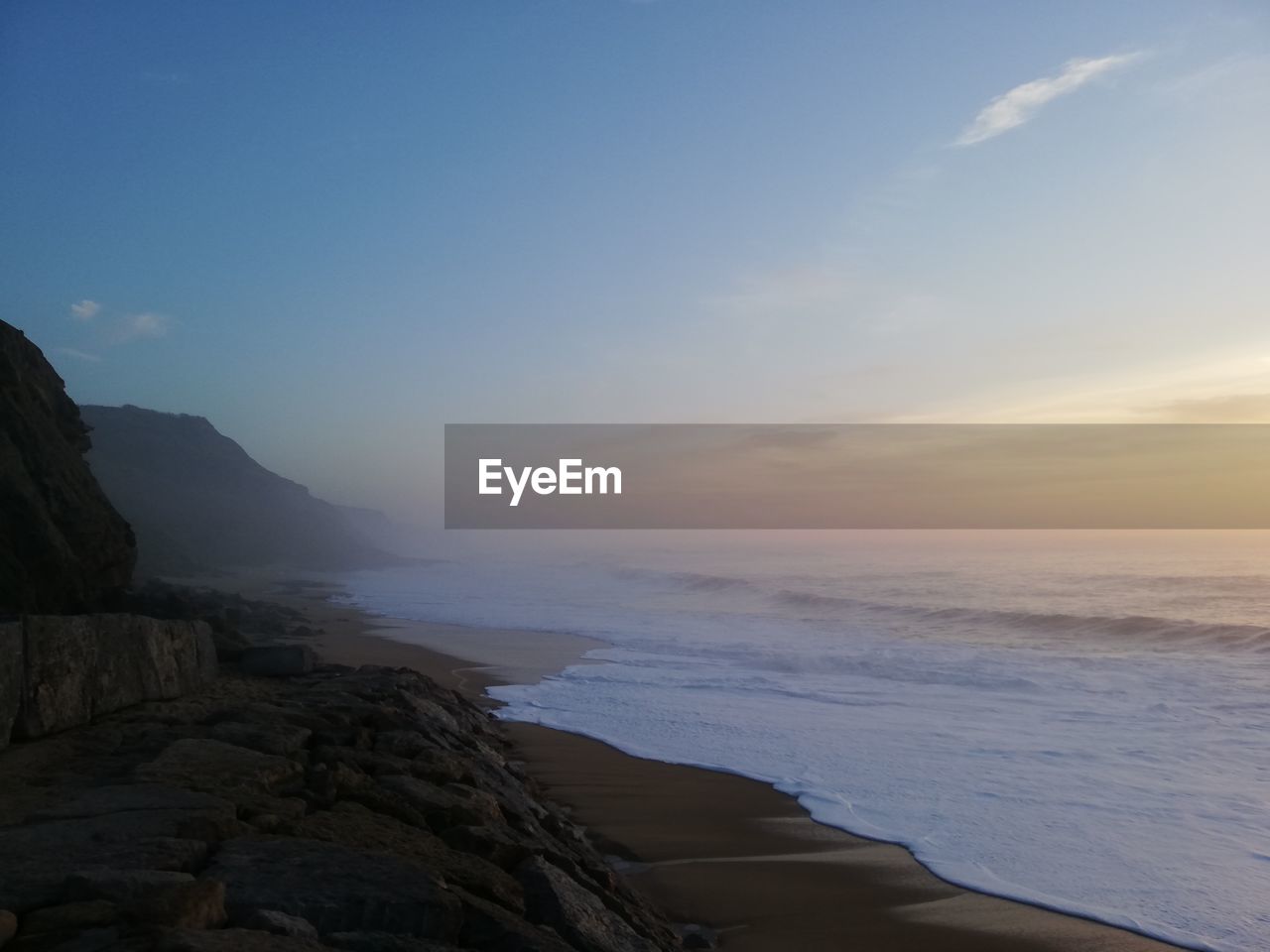 Scenic view of sea against sky during sunset