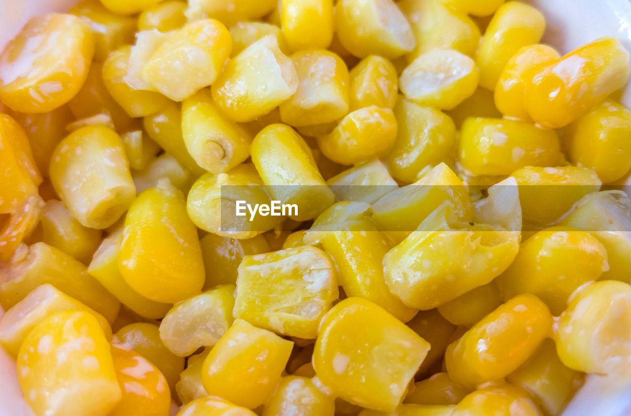 CLOSE UP OF YELLOW AND SALAD