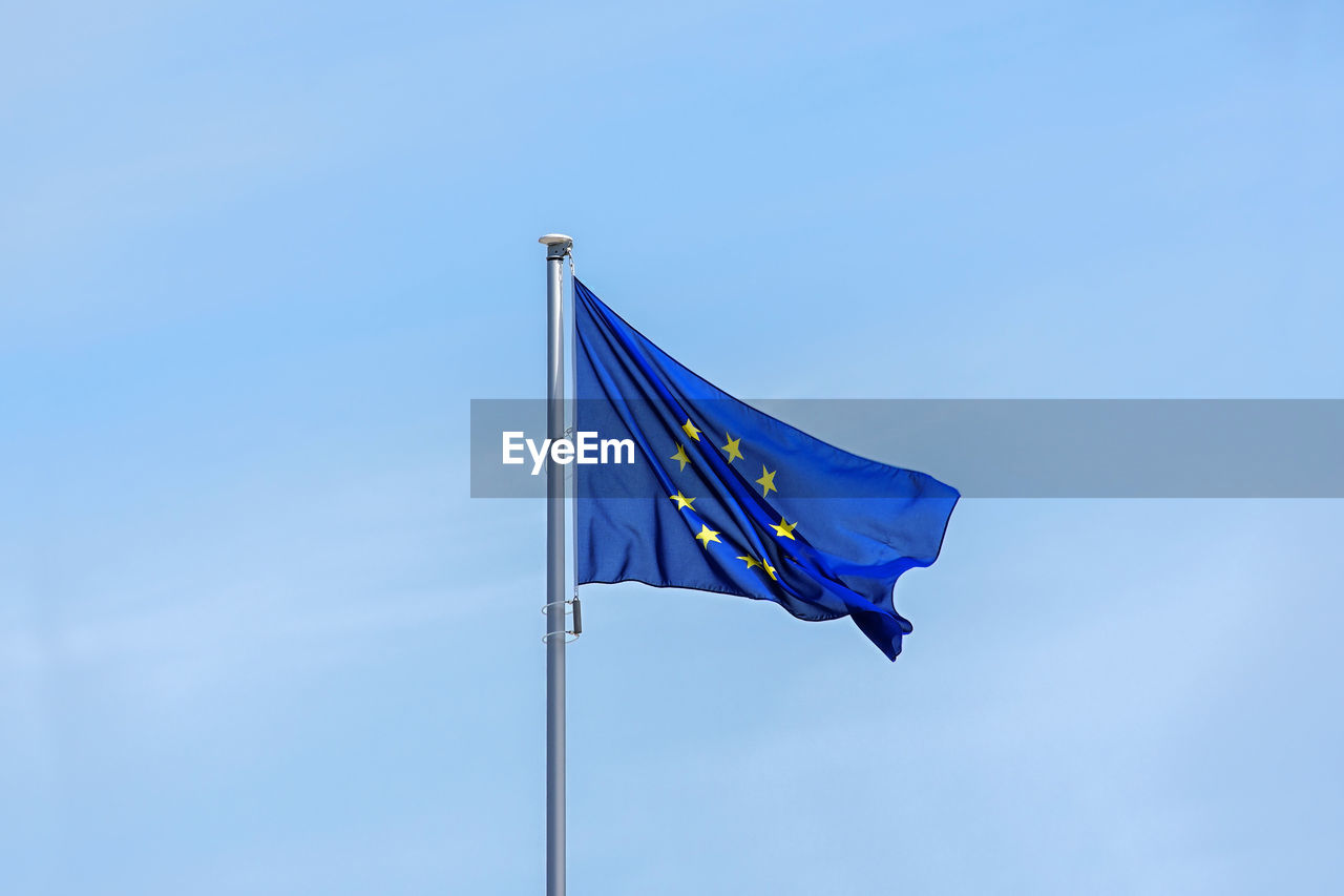 LOW ANGLE VIEW OF FLAGS FLAG AGAINST CLEAR BLUE SKY