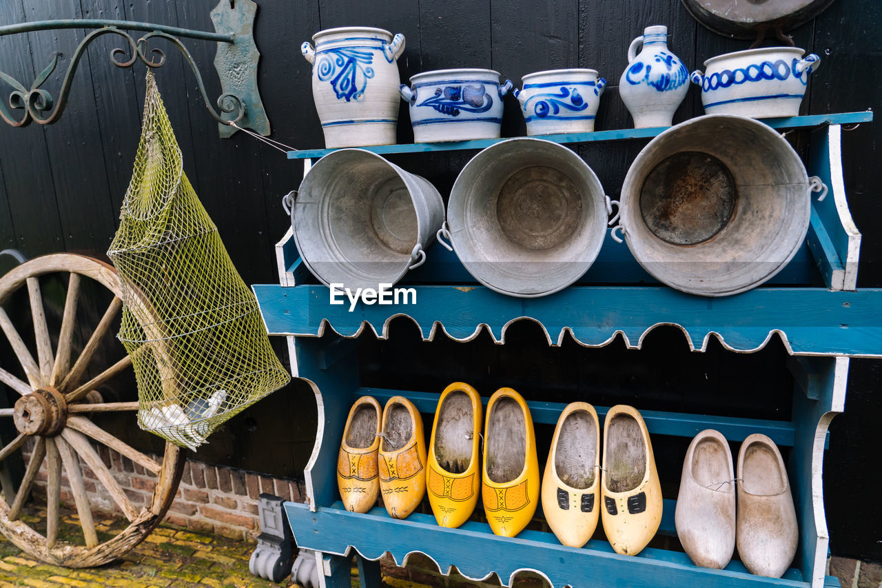 View of pottery and shoes for sale at market