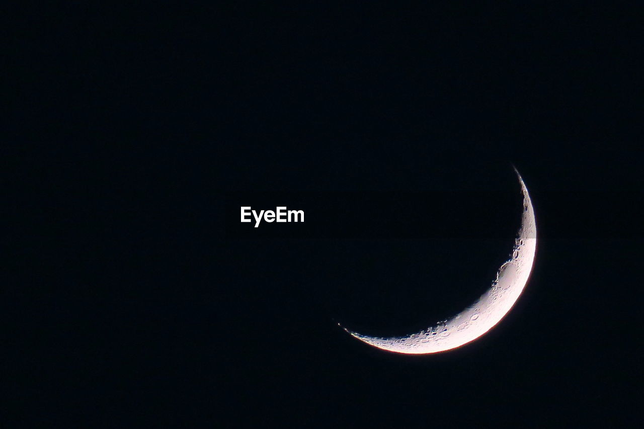 LOW ANGLE VIEW OF MOON AGAINST SKY AT NIGHT