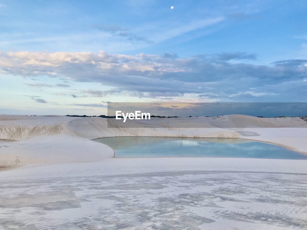 White sand dunes and lagoons formed by rainwater.