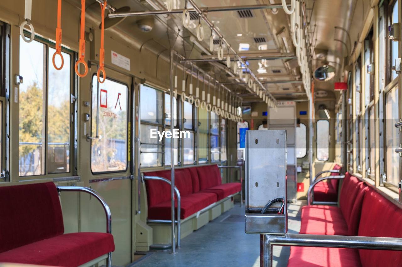 VIEW OF TRAIN IN EMPTY SUBWAY STATION